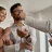 closeup-real-estate-agent-giving-couple-keys-their-new-home